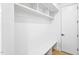Mudroom featuring storage shelves, a bench, and a white door at 810 Culpepper Ln, Raleigh, NC 27610