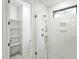 Modern shower with white tile, glass enclosure, and built-in shelving at 810 Culpepper Ln, Raleigh, NC 27610