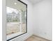 Bright room featuring a large window with a view of the front yard and street at 810 Culpepper Ln, Raleigh, NC 27610