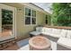 Inviting outdoor deck with comfortable seating and a modern fire pit at 90 Weatherly Dr, Franklinton, NC 27525