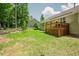 Spacious backyard with a wooden deck and lush landscaping, ideal for relaxation and enjoyment at 90 Weatherly Dr, Franklinton, NC 27525