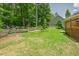 Lush backyard featuring a cozy outdoor seating area with comfortable seating and attractive landscaping at 90 Weatherly Dr, Franklinton, NC 27525