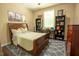 Inviting bedroom features a cozy bed and desk at 90 Weatherly Dr, Franklinton, NC 27525