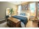 Bedroom with a comfortable bed, dresser, and natural light at 90 Weatherly Dr, Franklinton, NC 27525