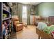 Charming Bedroom with giraffe-themed wallpaper, rocking chair, and crib at 90 Weatherly Dr, Franklinton, NC 27525