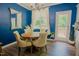 Dining room with round wood table, chandelier, and natural light at 90 Weatherly Dr, Franklinton, NC 27525