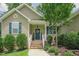 Charming single-Gathering home featuring a lovely front entrance with brick steps and a well-maintained landscaped yard at 90 Weatherly Dr, Franklinton, NC 27525