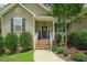 Close-up of the front porch, highlighting the charming details and decorative touches of the home's entrance at 90 Weatherly Dr, Franklinton, NC 27525