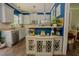 Stylish kitchen boasts modern white cabinets, stainless appliances, and wood flooring at 90 Weatherly Dr, Franklinton, NC 27525