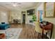 Open-concept living space with hardwood floors, a cozy fireplace, and stylish furnishings perfect for entertaining or relaxation at 90 Weatherly Dr, Franklinton, NC 27525