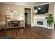 Cozy living area with a modern fireplace, hardwood floors, and elegant decor creating a warm and inviting space at 90 Weatherly Dr, Franklinton, NC 27525