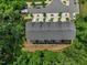 Aerial of townhouse complex with green surroundings and ample parking at 907 Lake Beacon Way, Raleigh, NC 27606