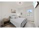 Bedroom with a decorative ceiling fan, wooden floors, natural light and a double bed at 907 Lake Beacon Way, Raleigh, NC 27606