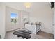 Bedroom with natural light, wooden floors, and an area rug. Includes a single bed at 907 Lake Beacon Way, Raleigh, NC 27606