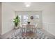 Sunny dining room featuring stylish decor and ample natural light from the large windows at 907 Lake Beacon Way, Raleigh, NC 27606