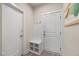 Entryway area with built in bench, coat rack, and storage at 907 Lake Beacon Way, Raleigh, NC 27606