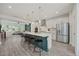 Contemporary kitchen with large center island and stainless appliances open to the living area at 907 Lake Beacon Way, Raleigh, NC 27606