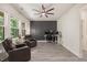 A welcoming living room with hardwood floors, a ceiling fan, and a designated office area at 907 Lake Beacon Way, Raleigh, NC 27606