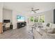 Inviting living area with an adjacent workspace, and a comfortable couch with a beautiful outdoor view at 907 Lake Beacon Way, Raleigh, NC 27606