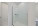 Bathroom featuring a spacious glass enclosed shower with marble tile and a double vanity at 907 Lake Beacon Way, Raleigh, NC 27606