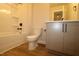 Bathroom with tub/shower combo, toilet, and vanity with shaker cabinets at 920 Montague Ave, Durham, NC 27703