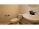 Bathroom with a toilet and sink at 920 Montague Ave, Durham, NC 27703