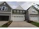 Charming new construction home featuring attached garages and manicured landscaping at 920 Montague Ave, Durham, NC 27703
