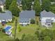 Expansive backyard with a private pool and lush landscaping, perfect for outdoor entertaining at 9220 Cornwell Dr, Wake Forest, NC 27587