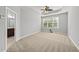 Comfortable bedroom with neutral carpet, ceiling fan and natural light from a large window at 9220 Cornwell Dr, Wake Forest, NC 27587