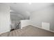 Upstairs bonus room with neutral carpet and natural light, creating a versatile space for various activities at 9220 Cornwell Dr, Wake Forest, NC 27587