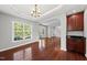 Elegant dining room featuring hardwood floors, updated lighting, and easy access to the kitchen at 9220 Cornwell Dr, Wake Forest, NC 27587