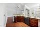 Open-concept kitchen with granite counters, modern appliances, and access to the living room at 9220 Cornwell Dr, Wake Forest, NC 27587