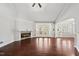 Spacious living room with a cozy fireplace, high ceilings, and access to the outdoor patio at 9220 Cornwell Dr, Wake Forest, NC 27587