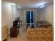 Cozy living room with floral sofas, French doors, and track lighting at 929 Morreene Rd # B-24, Durham, NC 27705