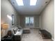 Spacious living room with plush seating and plenty of natural light at 929 Morreene Rd # D-34, Durham, NC 27705