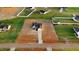 Aerial view showcases a new home with freshly laid grass and modern white fencing at 9427 Turkey Way, Middlesex, NC 27557