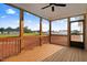 Open-air back porch showing wood flooring, wood rails, and neighborhood views at 9427 Turkey Way, Middlesex, NC 27557