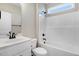Well-lit bathroom with a white vanity, toilet, and a shower-tub combo at 9427 Turkey Way, Middlesex, NC 27557