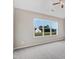 Bright bedroom with carpeted floor and natural light that offers serene views of the outside at 9427 Turkey Way, Middlesex, NC 27557