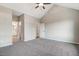 Spacious bedroom boasts vaulted ceilings, carpeted floors, and neutral tones for a relaxing ambiance at 9427 Turkey Way, Middlesex, NC 27557