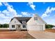 Charming two-story home with a two-car garage, dark roof, and light-colored siding at 9427 Turkey Way, Middlesex, NC 27557