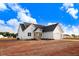 Beautiful new construction home with white siding, a dark roof, and an attached two-car garage at 9427 Turkey Way, Middlesex, NC 27557