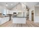 Modern kitchen with white cabinetry, granite countertops, stainless steel appliances and a functional center island at 9427 Turkey Way, Middlesex, NC 27557