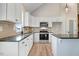 Updated kitchen with stainless steel appliances, modern countertops, and a convenient island for meal prep at 9427 Turkey Way, Middlesex, NC 27557