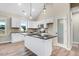 Stylish kitchen featuring granite countertops, subway tile backsplash, stainless steel appliances and center island at 9427 Turkey Way, Middlesex, NC 27557