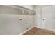 Functional laundry room with shelving, modern flooring and essential hookups at 9427 Turkey Way, Middlesex, NC 27557
