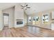 Bright living room with high ceilings, wood floors, modern fireplace, and access to the porch at 9427 Turkey Way, Middlesex, NC 27557