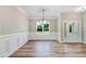 Bright, airy living room featuring wood floors, white walls with trim, and natural light at 9427 Turkey Way, Middlesex, NC 27557