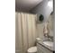 Well-lit bathroom featuring a granite-topped vanity, white paneling, and a shower at 956 W Greensboro Chapel Hill Rd, Snow Camp, NC 27349