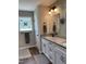 Elegant bathroom featuring a double sink vanity with granite countertops, enhancing its functional beauty at 956 W Greensboro Chapel Hill Rd, Snow Camp, NC 27349